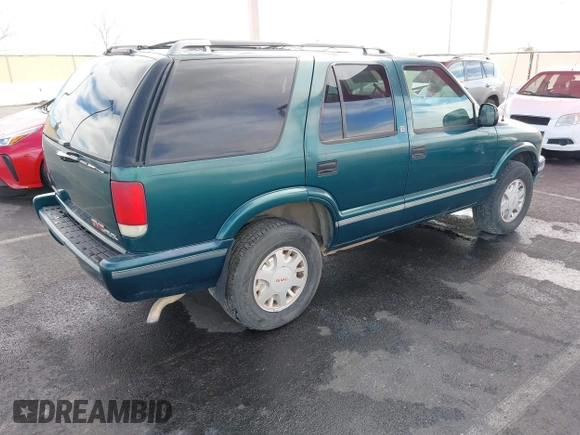 1997 GMC Jimmy SLS with VIN 1GKDT13W7V2516192, listed as a IAAI auction lot 41442979 with 154,518 mi miles. Bid and sale history available at carsss.com. Image 4.