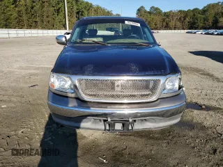 2002 Ford F-150 XL with VIN 1FTRX17L72NA39909, listed as a Copart auction lot 76376994 with 175,926 mi miles and Salvage title. Bid and sale history available at DreamBid. Image 5.