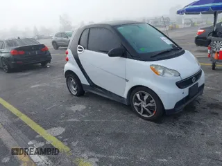 2013 Smart fortwo Pure with VIN WMEEJ3BA9DK631660, listed as a IAAI auction lot 41917570 with 65,890 mi miles. Bid and sale history available at carsss.com. Image 1.
