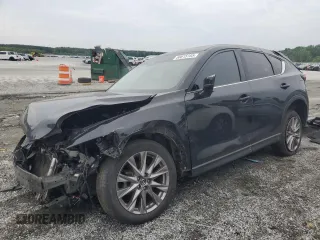 2019 Mazda CX-5 Grand Touring with VIN JM3KFBDM4K0552207, listed as a Copart auction lot 58615185 with 106,550 mi miles and Salvage title. Bid and sale history available at DreamBid. Image 1.