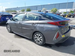 2022 Toyota Prius LE with VIN JTDKAMFP7N3206830, listed as a IAAI auction lot 41984239 with 57,681 mi miles and . Bid and sale history available at DreamBid. Image 3.