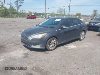 2015 Ford Focus Titanium with VIN 1FADP3J24FL277732, listed as a IAAI auction lot 41903397 with 238,138 mi miles and . Bid and sale history available at carsss.com. Image 2.
