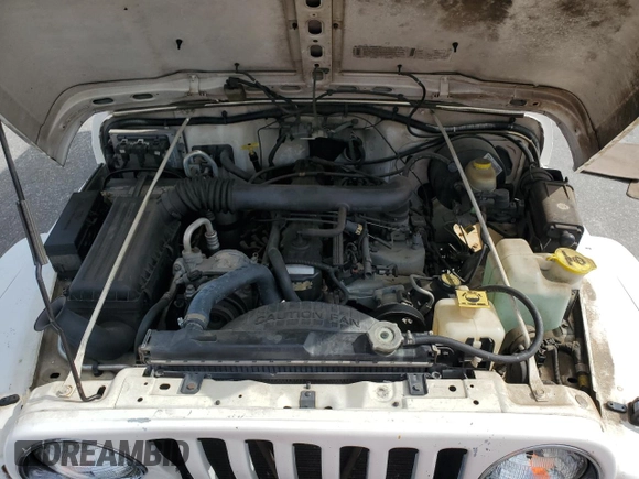 1999 Jeep Wrangler Sahara z VIN 1J4FY49S0XP432968, wystawiony jako Copart lot #65033715 z przebiegiem 126 420 mil mil oraz Szkoda całkowita • Salvage title. Historia ofert i sprzedaży dostępna na DreamBid. Obrazek 11.