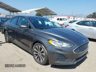 2020 Ford Fusion SE z VIN 3FA6P0T99LR173347, wystawiony jako IAAI lot #42090457 z przebiegiem 118 359 mil mil oraz . Historia ofert i sprzedaży dostępna na DreamBid. Obrazek 1.