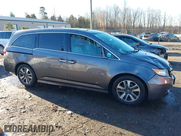 2014 Honda Odyssey Touring with VIN 5FNRL5H94EB081267, listed as a IAAI auction lot 41199509 with 146,827 mi miles and . Bid and sale history available at DreamBid. Image 6.