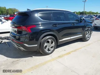 2021 Hyundai Santa Fe SEL with VIN 5NMS24AJ9MH331876, listed as a IAAI auction lot 41821775 with 56,756 mi miles. Bid and sale history available at carsss.com. Image 4.
