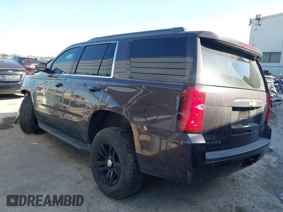2015 Chevrolet Tahoe LS with VIN 1GNSCAKCXFR628303, listed as a IAAI auction lot 42002698 with 152,141 mi miles and . Bid and sale history available at DreamBid. Image 3.