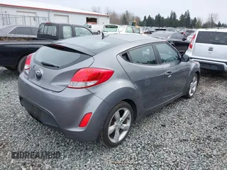 2012 Hyundai Veloster w/Gray Int z VIN KMHTC6AD7CU037130, wystawiony jako IAAI lot #41778588 z przebiegiem 125 549 mil mil oraz . Historia ofert i sprzedaży dostępna na DreamBid. Obrazek 4.