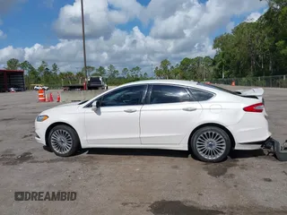 2016 Ford Fusion Titanium with VIN 3FA6P0K96GR400436, listed as a IAAI auction lot 42191256 with 128,447 mi miles and . Bid and sale history available at DreamBid. Image 14.