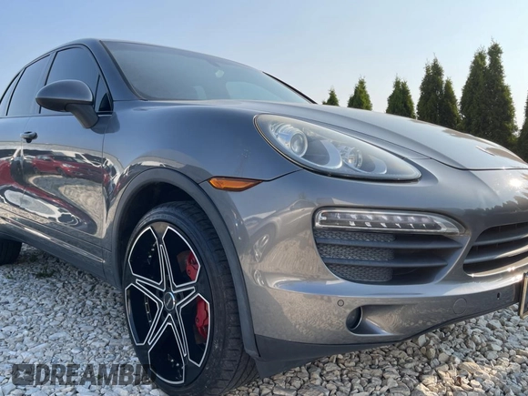 2011 Porsche Cayenne S with VIN WP1AB2A22BLA47332, listed as a Copart auction lot 65087385 with 112,033 mi miles and Salvage title. Bid and sale history available at DreamBid. Image 1.