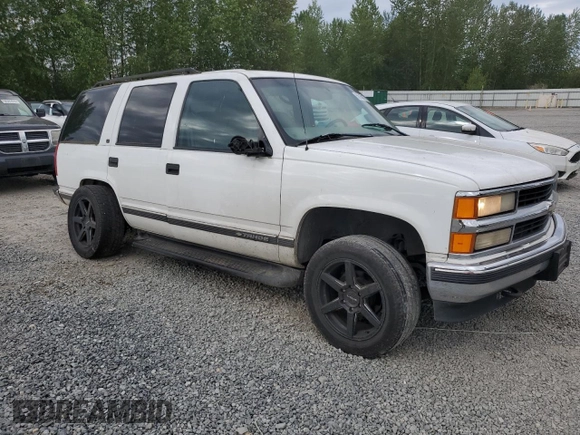 1999 Chevrolet Tahoe Z71 with VIN 1GNEK13R1XJ365475, listed as a Copart auction lot 56258175 with 184,647 mi miles and Clean Title. Bid and sale history available at DreamBid. Image 4.