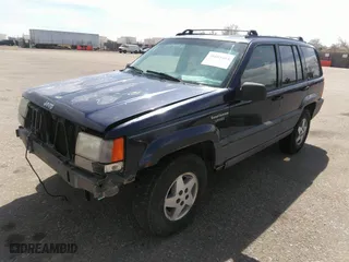 1994 Jeep Grand Cherokee Laredo with VIN 1J4GZ58Y3RC202638, listed as a IAAI auction lot 41885484 with 164,481 mi miles. Bid and sale history available at carsss.com. Image 2.