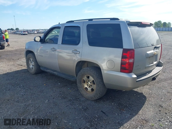 2007 Chevrolet Tahoe LT with VIN 1GNFK13087R165703, listed as a IAAI auction lot 42370222 with 150,014 mi miles and . Bid and sale history available at DreamBid. Image 3.