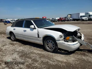 2001 Lincoln Town Car Cartier z VIN 1LNHM83W91Y728971, wystawiony jako Copart lot #50643965 z przebiegiem Nie podano mil oraz Szkoda całkowita • Salvage title. Historia ofert i sprzedaży dostępna na DreamBid. Obrazek 4.