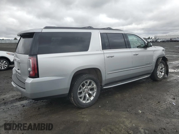2015 GMC Yukon XL SLT with VIN 1GKS2HKC8FR616031, listed as a Copart auction lot 48740785 with 128,467 mi miles and Salvage Title. Bid and sale history available at carsss.com. Image 3.