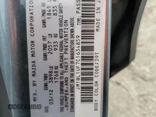 2012 Mazda 3 i Sport with VIN JM1BL1UF7C1634859, listed as a Copart auction lot 77349494 with 126,248 mi miles and Salvage Title. Bid and sale history available at DreamBid. Image 14.