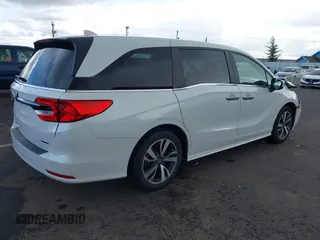 2022 Honda Odyssey Touring with VIN 5FNRL6H8XNB057293, listed as a IAAI auction lot 41826014 with 30,454 mi miles and . Bid and sale history available at DreamBid. Image 4.