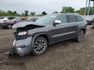 2017 Jeep Grand Cherokee Overland with VIN 1C4RJFCG8HC607872, listed as a Copart auction lot 57493195 with 164,478 mi miles and Salvage title. Bid and sale history available at DreamBid. Image 1.