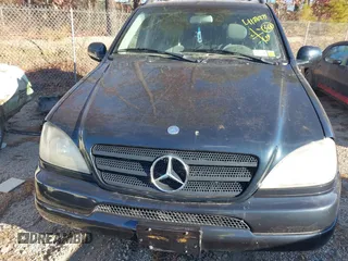 2000 Mercedes-Benz M-Class with VIN 4JGAB54E0YA146627, listed as a IAAI auction lot 41292173 with 116,790 mi miles. Bid and sale history available at carsss.com. Image 6.