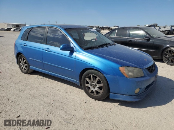 2005 Kia Spectra with VIN KNAFE161555082073, listed as a Copart auction lot 77062804 with 173,387 mi miles and Salvage Title. Bid and sale history available at DreamBid. Image 4.