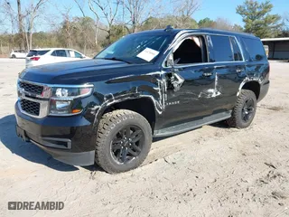 2019 Chevrolet Tahoe LT with VIN 1GNSKBKC3KR345776, listed as a IAAI auction lot 41674948 with 119,871 mi miles. Bid and sale history available at carsss.com. Image 2.