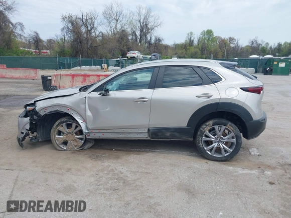 2022 Mazda CX-30 S Select z VIN 3MVDMBBL2NM439681, wystawiony jako IAAI lot #41960902 z przebiegiem 22 730 mil mil oraz . Historia ofert i sprzedaży dostępna na DreamBid. Obrazek 14.