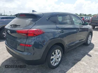 2021 Hyundai Tucson SE with VIN KM8J23A41MU291085, listed as a IAAI auction lot 41956974 with 93,932 mi miles. Bid and sale history available at carsss.com. Image 4.