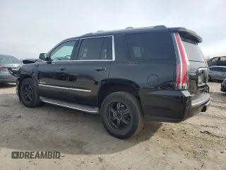 2015 GMC Yukon Denali with VIN 1GKS1CKJ1FR303049, listed as a Copart auction lot 82435514 with 100,693 mi miles and Salvage Title. Bid and sale history available at carsss.com. Image 2.