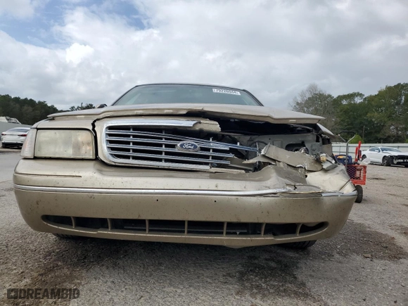 2000 Ford Crown Victoria LX with VIN 2FAFP74W7YX117705, listed as a Copart auction lot 79226944 with 128,019 mi miles and Salvage Title. Bid and sale history available at carsss.com. Image 5.