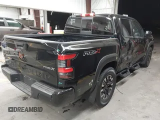 2022 Nissan Frontier SV z VIN 1N6ED1EJ5NN627303, wystawiony jako IAAI lot #41665799 z przebiegiem 59 462 mil mil oraz . Historia ofert i sprzedaży dostępna na DreamBid. Obrazek 4.