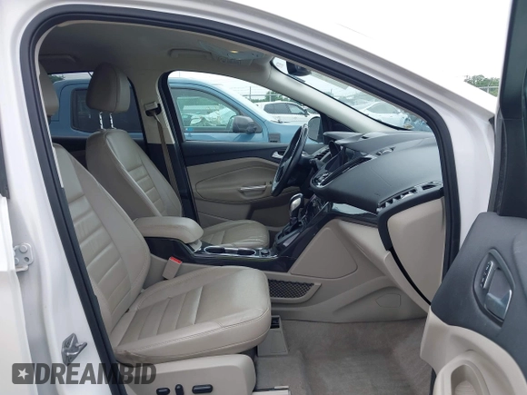 2016 Ford Escape Titanium with VIN 1FMCU9JX4GUB72080, listed as a IAAI auction lot 42519240 with 121,793 mi miles and . Bid and sale history available at DreamBid. Image 5.