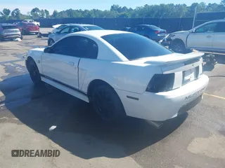 2004 Ford Mustang Standard z VIN 1FAFP40654F229283, wystawiony jako IAAI lot #42309648 z przebiegiem 164 610 mil mil oraz . Historia ofert i sprzedaży dostępna na DreamBid. Obrazek 3.
