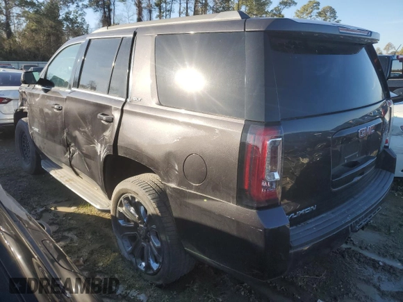 2015 GMC Yukon SLT with VIN 1GKS1BKC0FR239629, listed as a Copart auction lot 42247555 with 171,641 mi miles and Salvage Title. Bid and sale history available at carsss.com. Image 2.