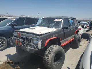 1991 Jeep Cherokee z VIN 1J4FJ58S6ML588768, wystawiony jako Copart lot #49748515 z przebiegiem 193 621 mil mil oraz Nie do naprawy • Non repairable. Historia ofert i sprzedaży dostępna na DreamBid. Obrazek 1.