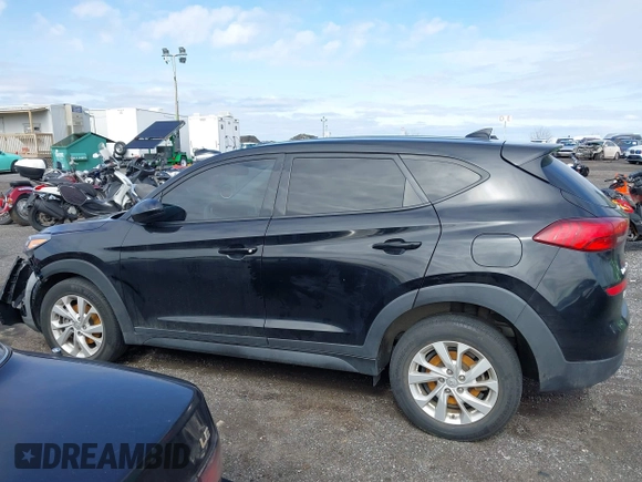 2019 Hyundai Tucson SE with VIN KM8J2CA46KU977863, listed as a IAAI auction lot 41704318 with 23,076 mi miles. Bid and sale history available at carsss.com. Image 14.