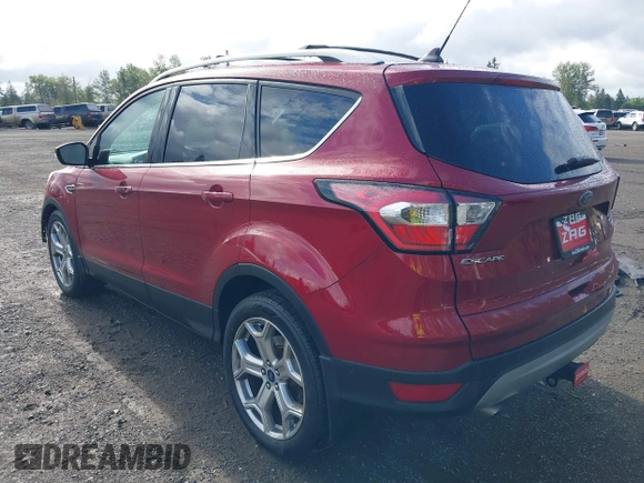 2018 Ford Escape Titanium with VIN 1FMCU9J99JUB44963, listed as a IAAI auction lot 42293113 with 68,803 mi miles and . Bid and sale history available at DreamBid. Image 3.