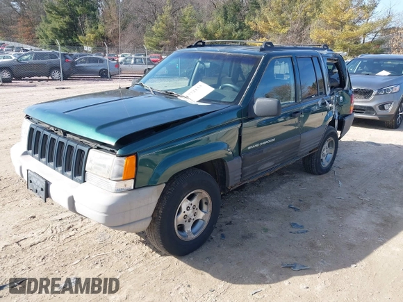 1997 Jeep Grand Cherokee Laredo with VIN 1J4GZ58S2VC595442, listed as a IAAI auction lot 41772133 with 229,764 mi miles. Bid and sale history available at carsss.com. Image 2.