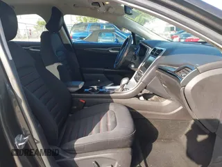 2016 Ford Fusion SE Hybrid z VIN 3FA6P0LU6GR145421, wystawiony jako IAAI lot #42650918 z przebiegiem 105 990 mil mil oraz . Historia ofert i sprzedaży dostępna na DreamBid. Obrazek 5.