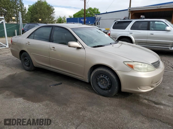2002 Toyota Camry LE z VIN 4T1BE32K92U524457, wystawiony jako Copart lot #56864365 z przebiegiem 274 760 mil mil oraz Czysty tytuł • Clean title. Historia ofert i sprzedaży dostępna na DreamBid. Obrazek 4.
