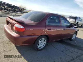 2001 Kia Sephia z VIN KNAFB121015028494, wystawiony jako Copart lot #81581404 z przebiegiem 86 655 mil mil oraz Szkody całkowita. Historia ofert i sprzedaży dostępna na DreamBid. Obrazek 3.