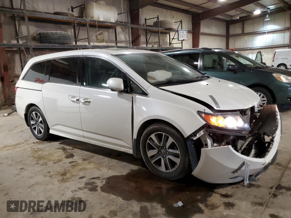 2014 Honda Odyssey Touring with VIN 5FNRL5H90EB137575, listed as a Copart auction lot 54606535 with 168,714 mi miles and Salvage title. Bid and sale history available at DreamBid. Image 4.