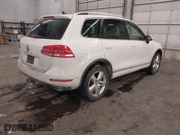 2013 Volkswagen Touareg Lux with VIN WVGEF9BP5DD011511, listed as a IAAI auction lot 41608840 with 167,350 mi miles and . Bid and sale history available at DreamBid. Image 4.