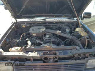 1986 Nissan Hardbody z VIN 1N6ND11S3GC381896, wystawiony jako Copart lot #44219045 z przebiegiem 124 009 mil mil oraz Szkody całkowita. Historia ofert i sprzedaży dostępna na DreamBid. Obrazek 11.