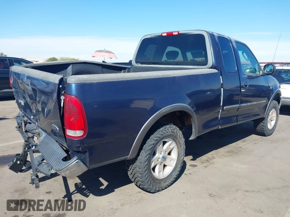 2003 Ford F-150 XL with VIN 1FTRX18WX3NA22323, listed as a IAAI auction lot 41635869 with 129,029 mi miles. Bid and sale history available at carsss.com. Image 4.
