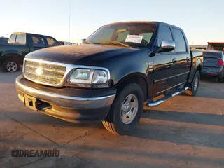 2002 Ford F-150 XLT with VIN 1FTRW07622KD31203, listed as a IAAI auction lot 41401506 with 166,949 mi miles. Bid and sale history available at carsss.com. Image 2.