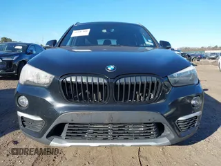 2018 BMW X1 xDrive28i with VIN WBXHT3C36J5L29746, listed as a IAAI auction lot 41547100 with 103,420 mi miles and . Bid and sale history available at DreamBid. Image 12.