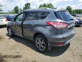 2014 Ford Escape Titanium with VIN 1FMCU9J91EUC90702, listed as a Copart auction lot 59116194 with 117,984 mi miles and Salvage Title. Bid and sale history available at DreamBid. Image 2.
