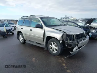 2003 GMC Envoy SLT with VIN 1GKDT13S532308502, listed as a IAAI auction lot 41676188 with 218,626 mi miles. Bid and sale history available at carsss.com. Image 1.