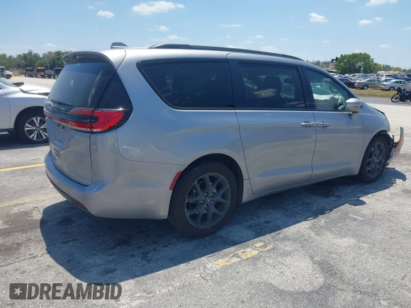 2021 Chrysler Pacifica Touring L with VIN 2C4RC1BG3MR591256, listed as a IAAI auction lot 42062406 with 58,117 mi miles and . Bid and sale history available at DreamBid. Image 4.