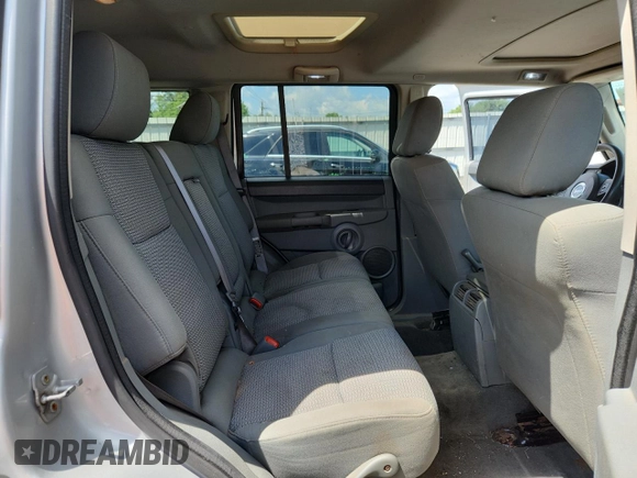 2007 Jeep Commander Sport z VIN 1J8HG48P47C691235, wystawiony jako Copart lot #64057505 z przebiegiem 135 641 mil mil oraz Szkoda całkowita • Salvage title. Historia ofert i sprzedaży dostępna na DreamBid. Obrazek 11.